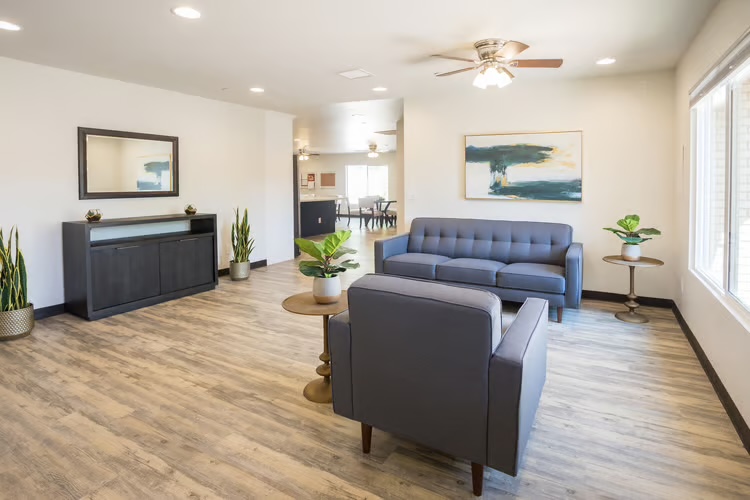 Living room with sofas and natural light at McCormick Ranch Assisted Living in Scottsdale